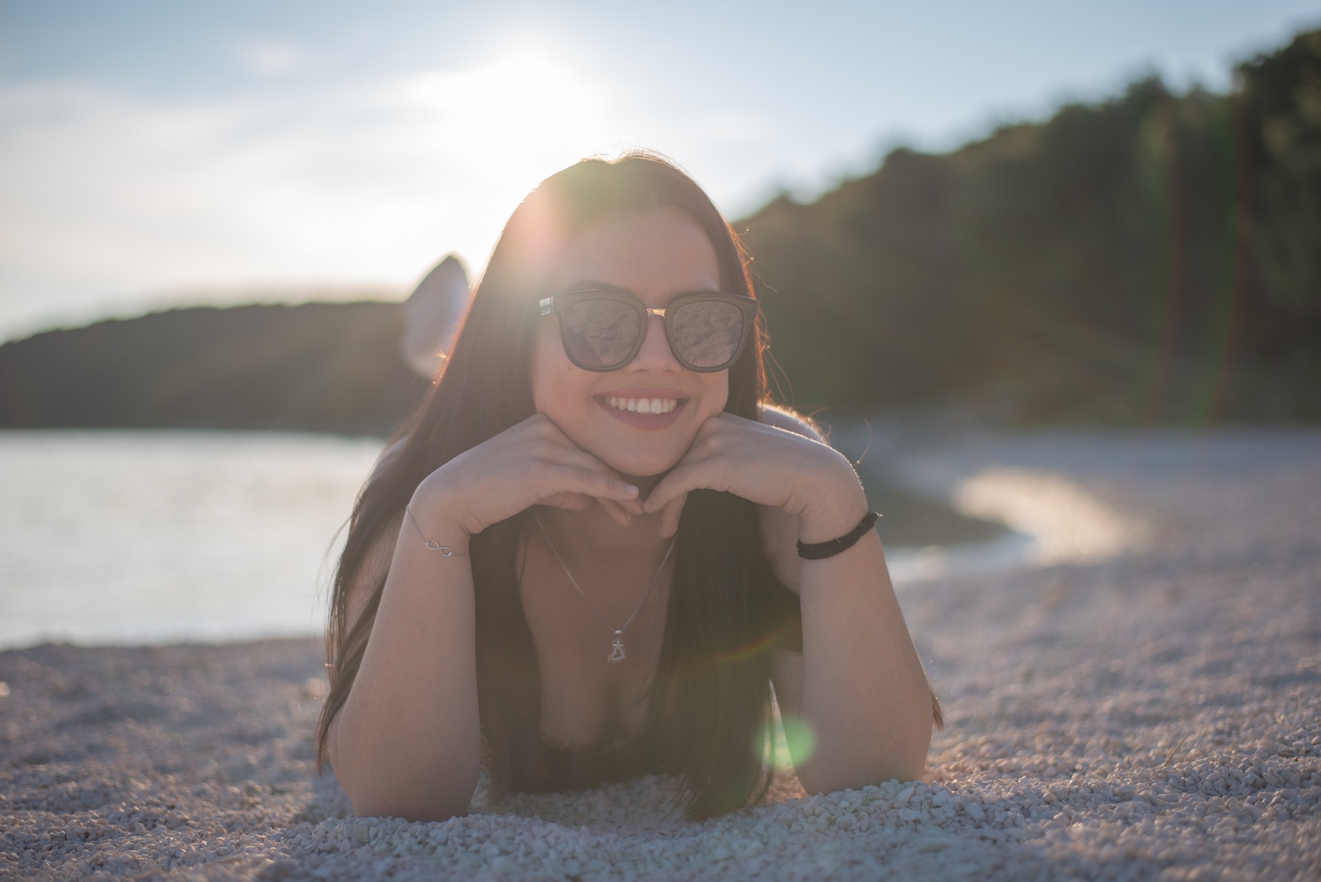 girl with glasses on beach