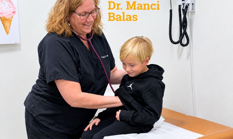 Dr. Manci Balas providing pediatric care at Ross Bridge Medical Center.