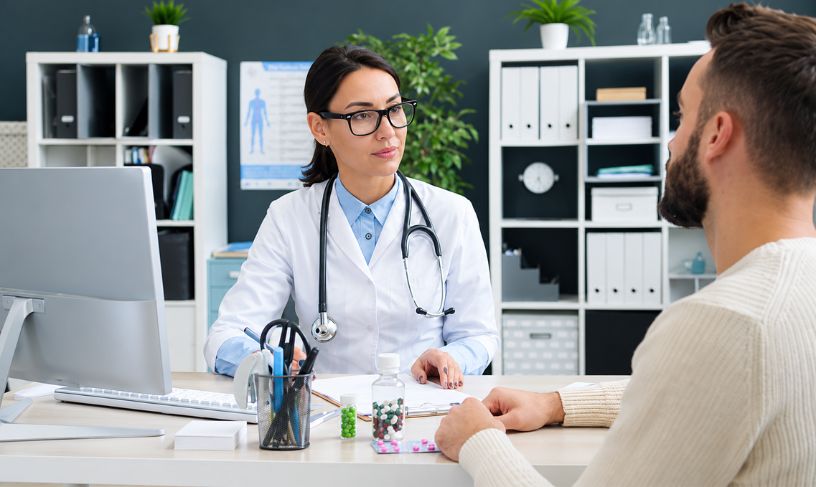 Doctor and patient discussing medical cannabis evaluation process and treatment options in a medical office